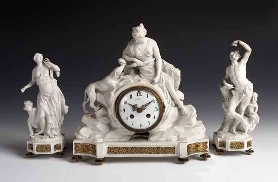 A French biscuit and gilt bronze garniture de cheminee,