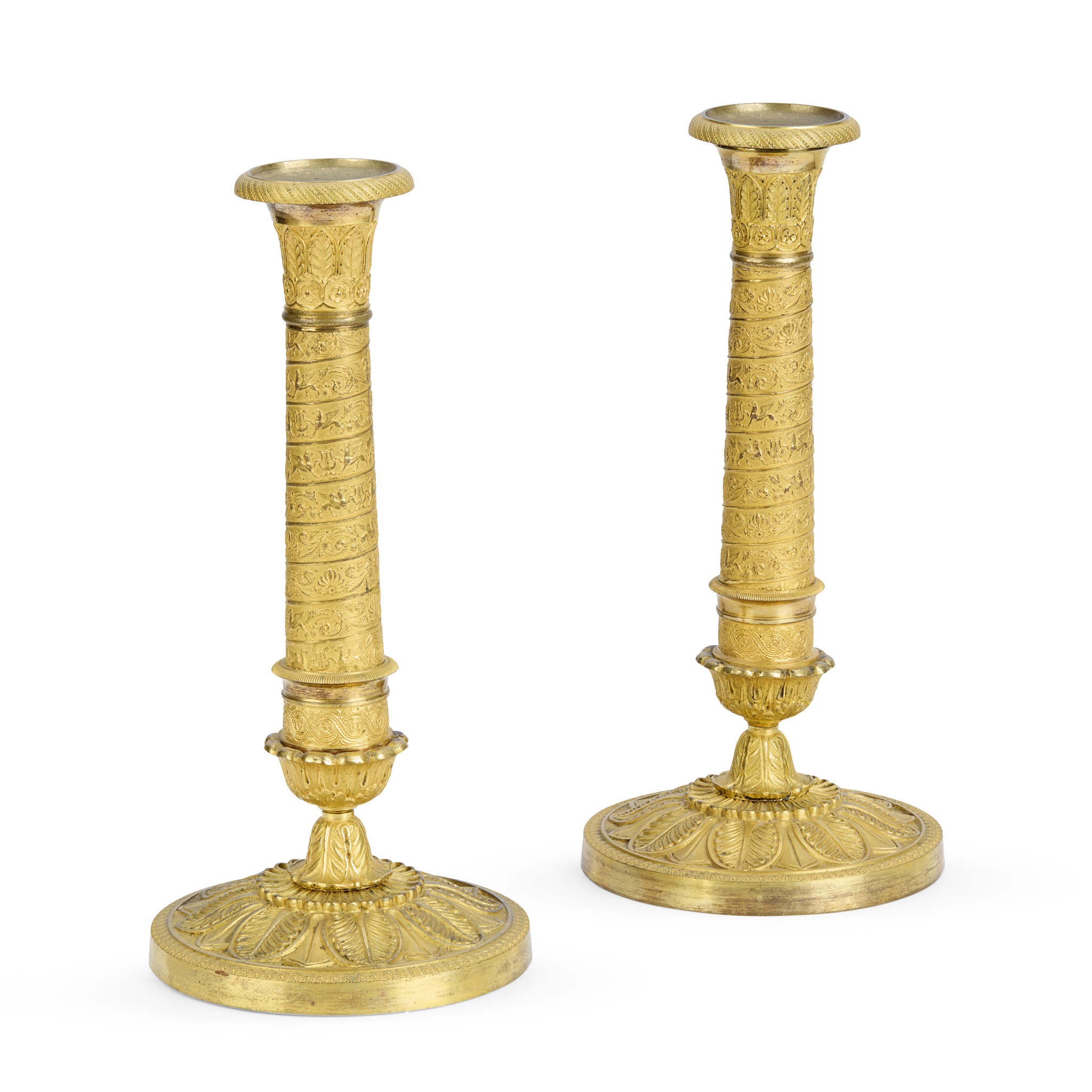 A PAIR OF FRENCH RESTAURATION GILT METAL COLUMN CANDLESTICKS, IN THE MANNER OF CHOISELAT-GALIEN