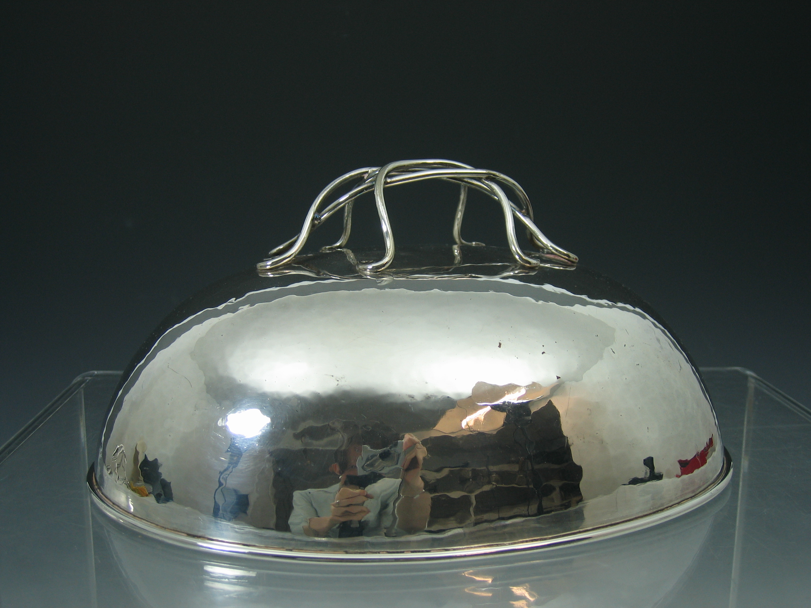 C.R. Ashbee (1863-1942) An Arts and Crafts electroplated dish cover,