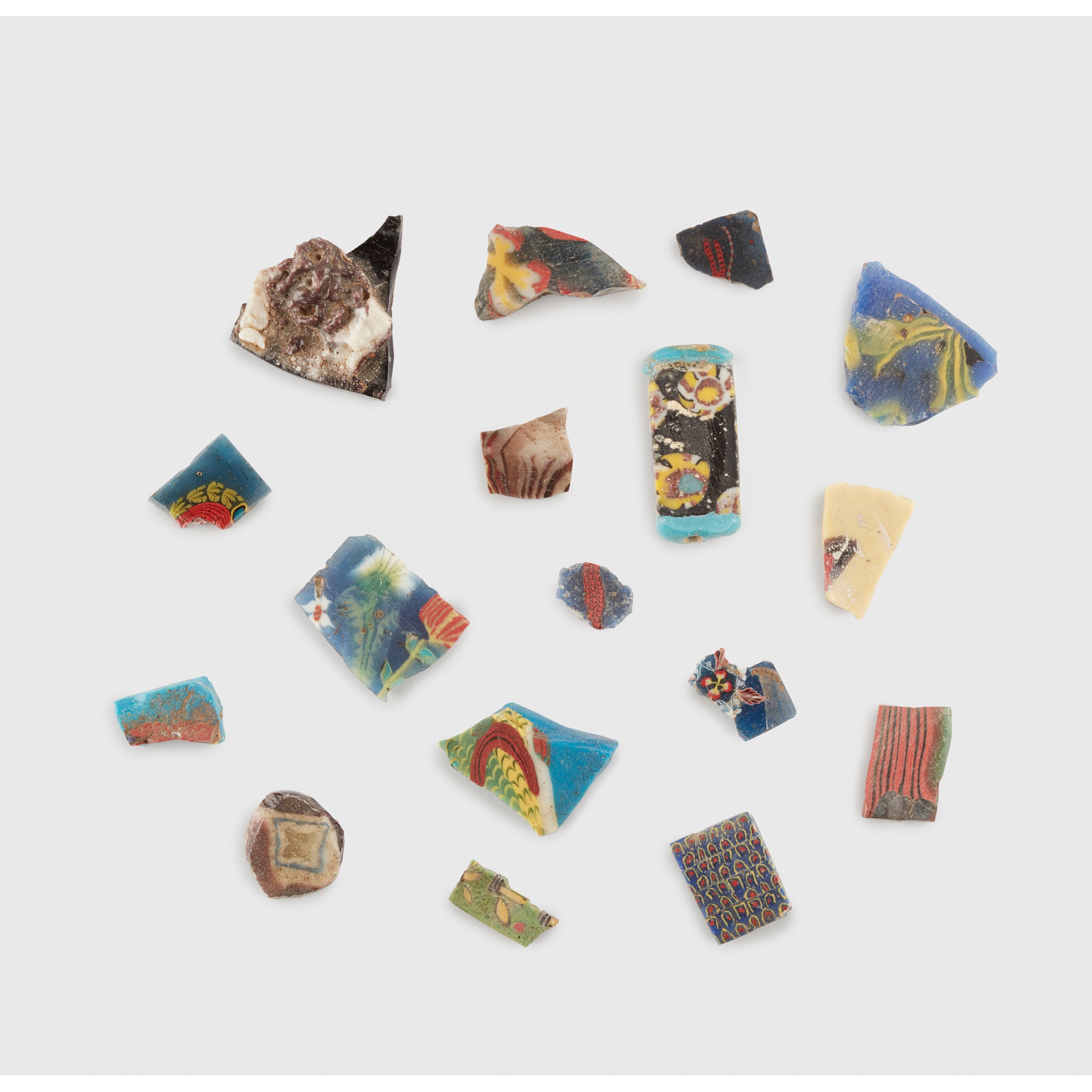 COLLECTION OF ANCIENT GLASS INLAY FRAGMENTS