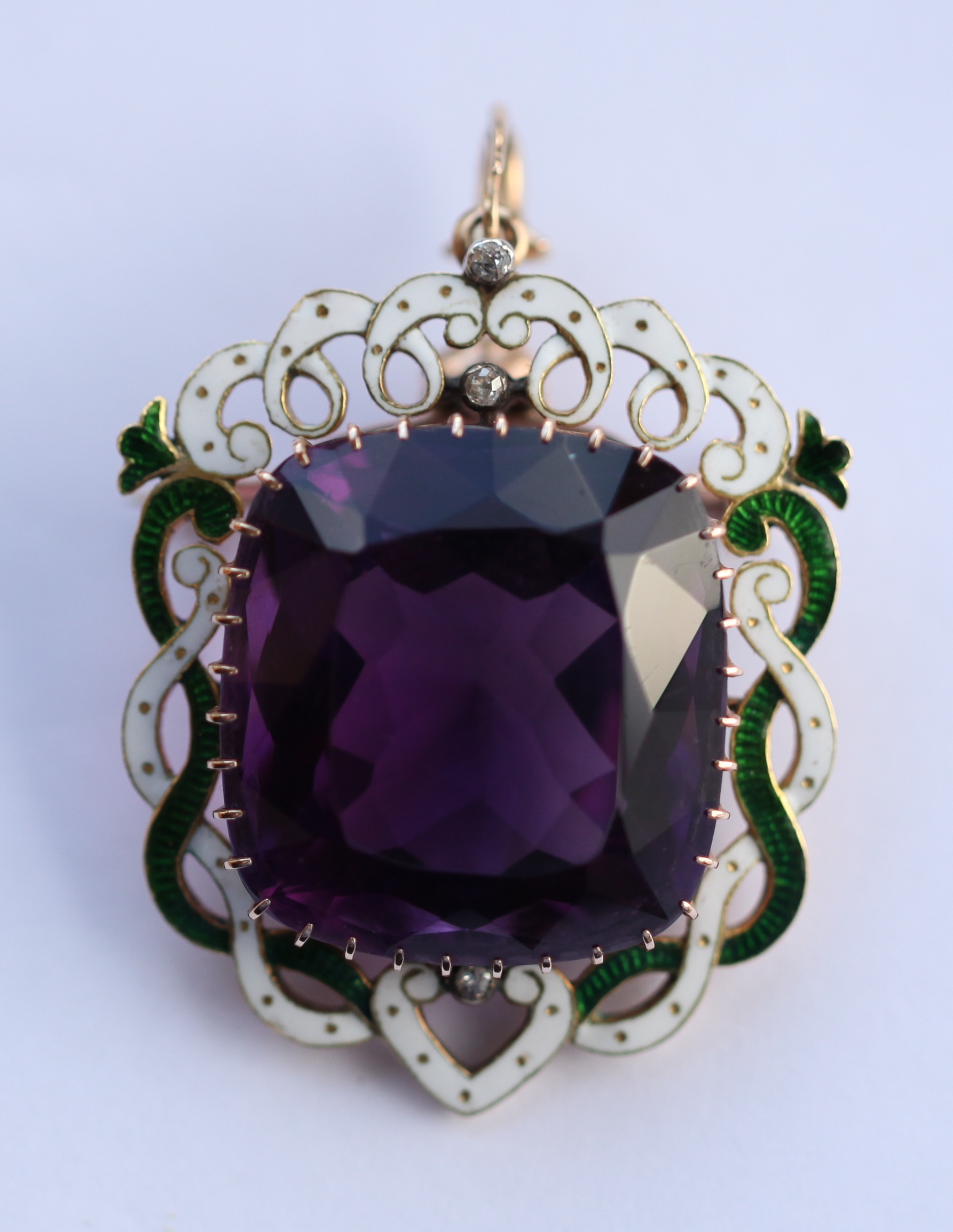 SUFFRAGETTE INTEREST - A gold and enamelled amethyst pendant