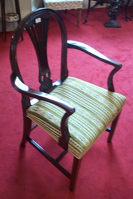 A set of six George III style mahogany dining chairs,