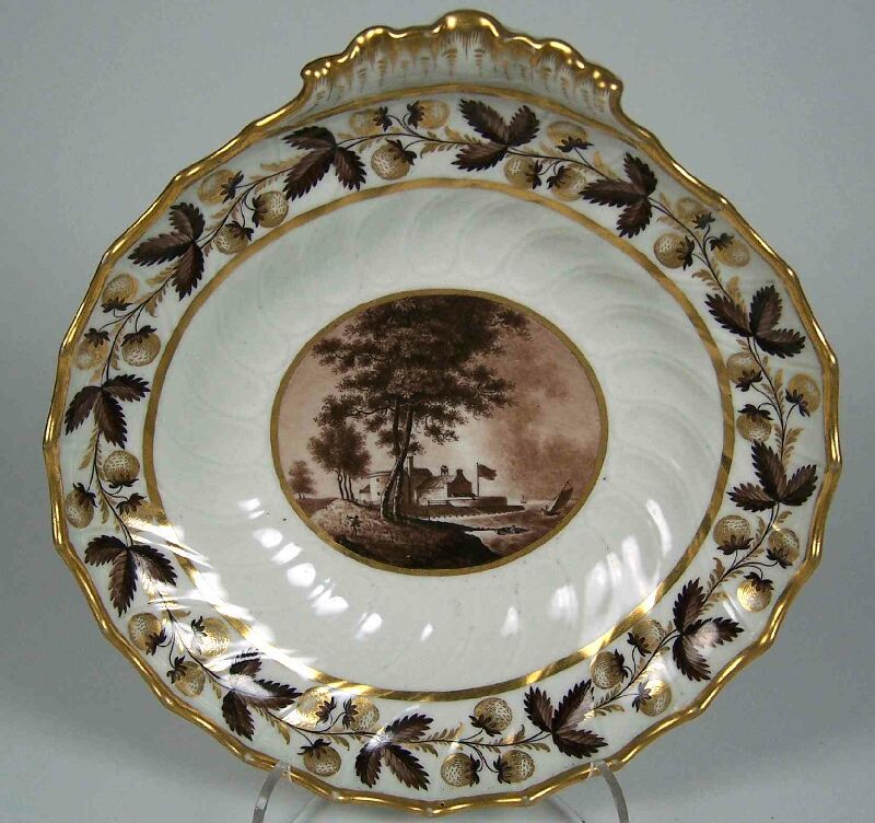 A Flight & Barr scalloped oval single handled topographical fruit dish depicting Cowes Castle, Isle of Wight, circa 1795