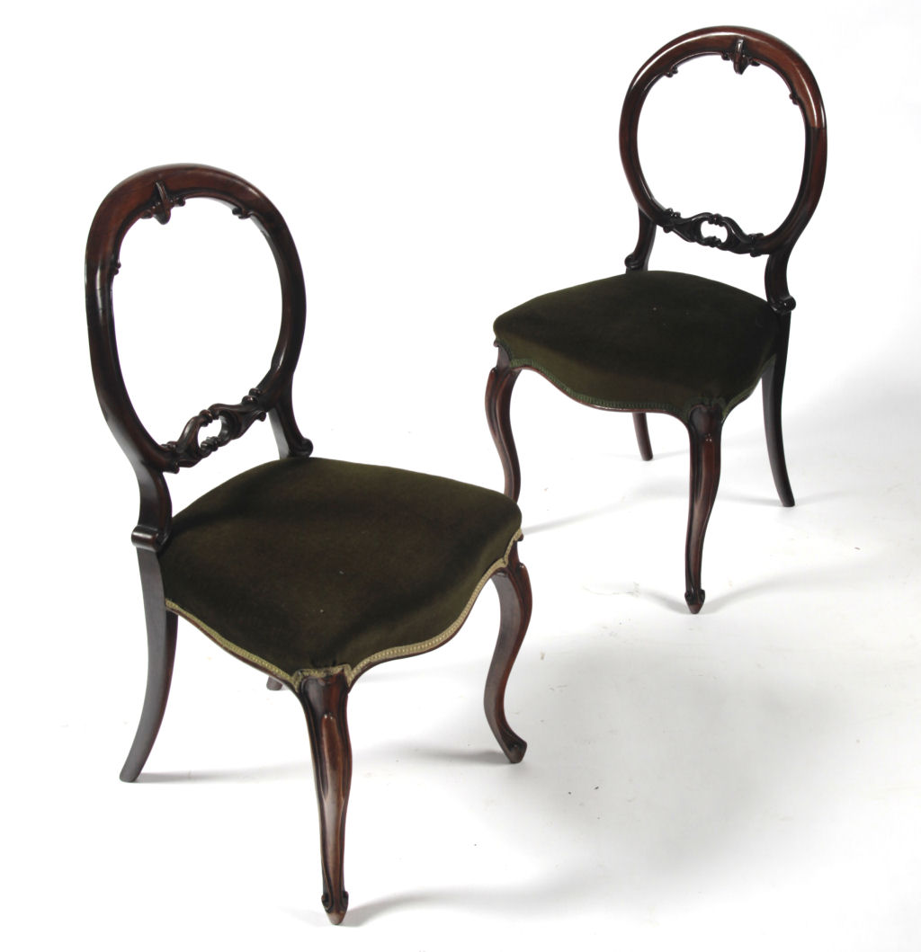 A set of five Victorian rosewood balloon back chairs