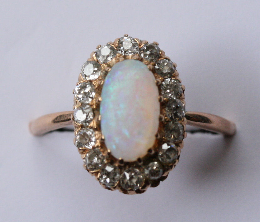An early 20th century opal and diamond cluster ring