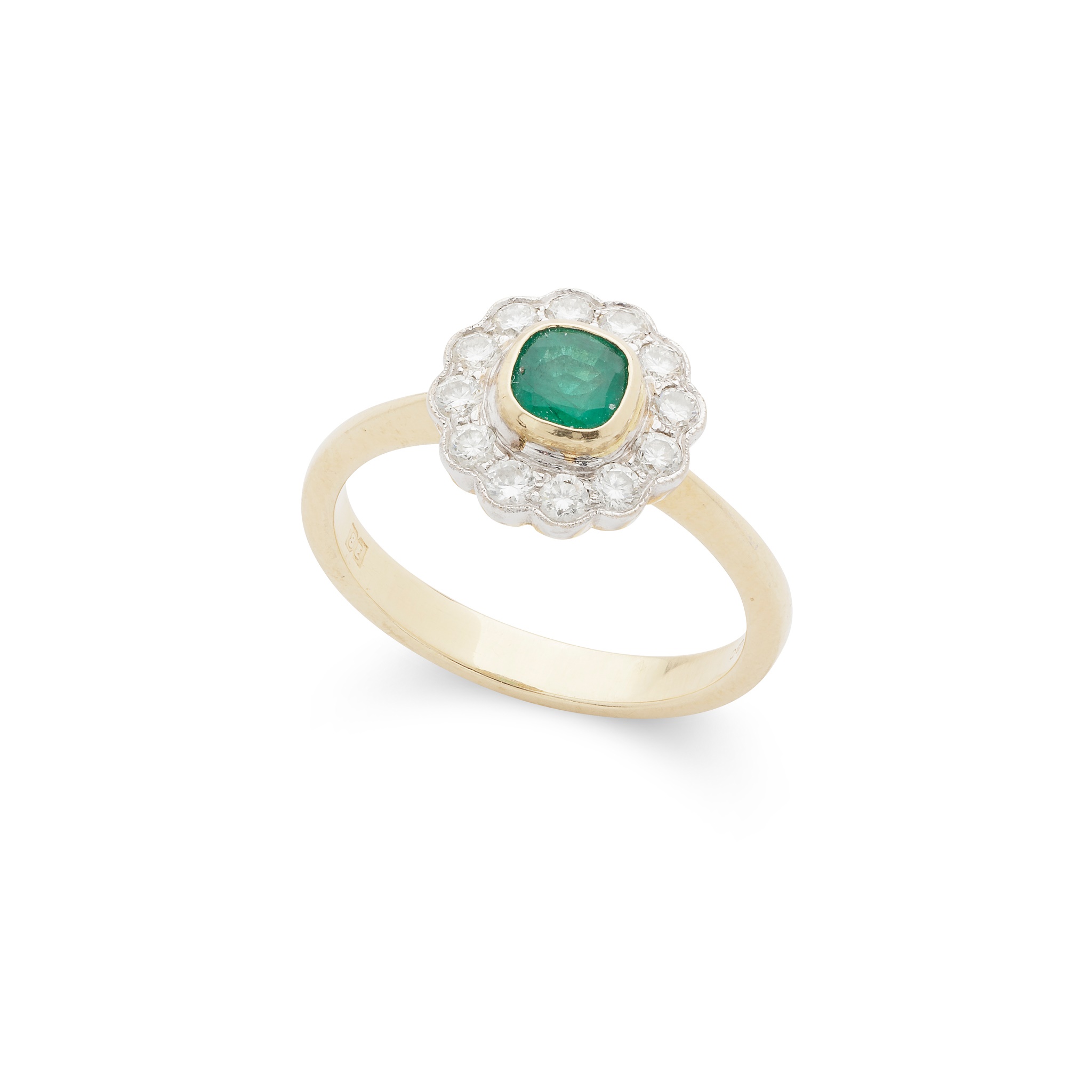 An emerald and diamond cluster ring