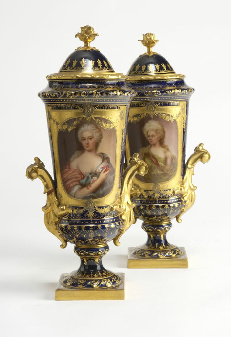 A pair of late 19th century Rudolstadt Volkstedt twin handled vases and covers