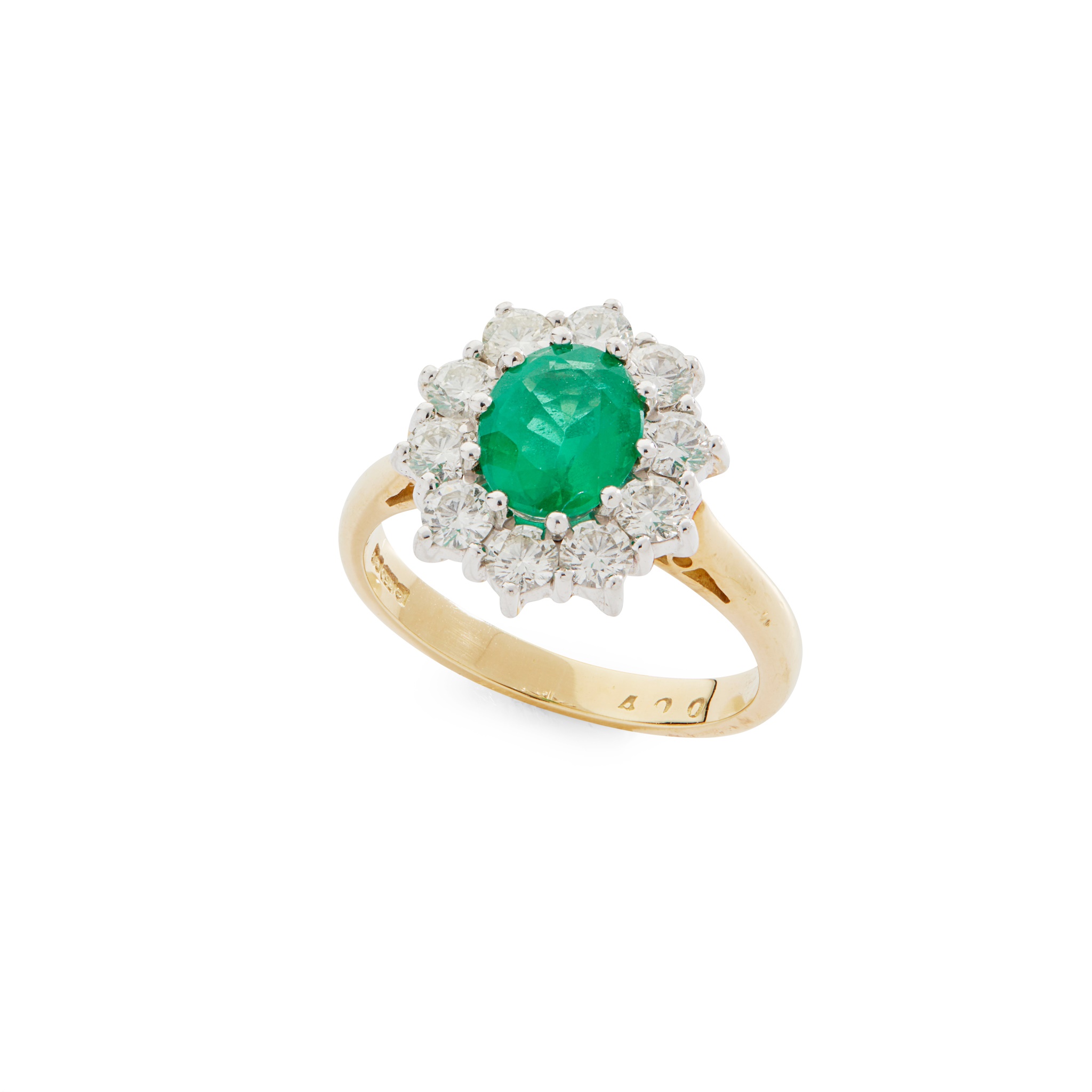 An emerald and diamond cluster ring