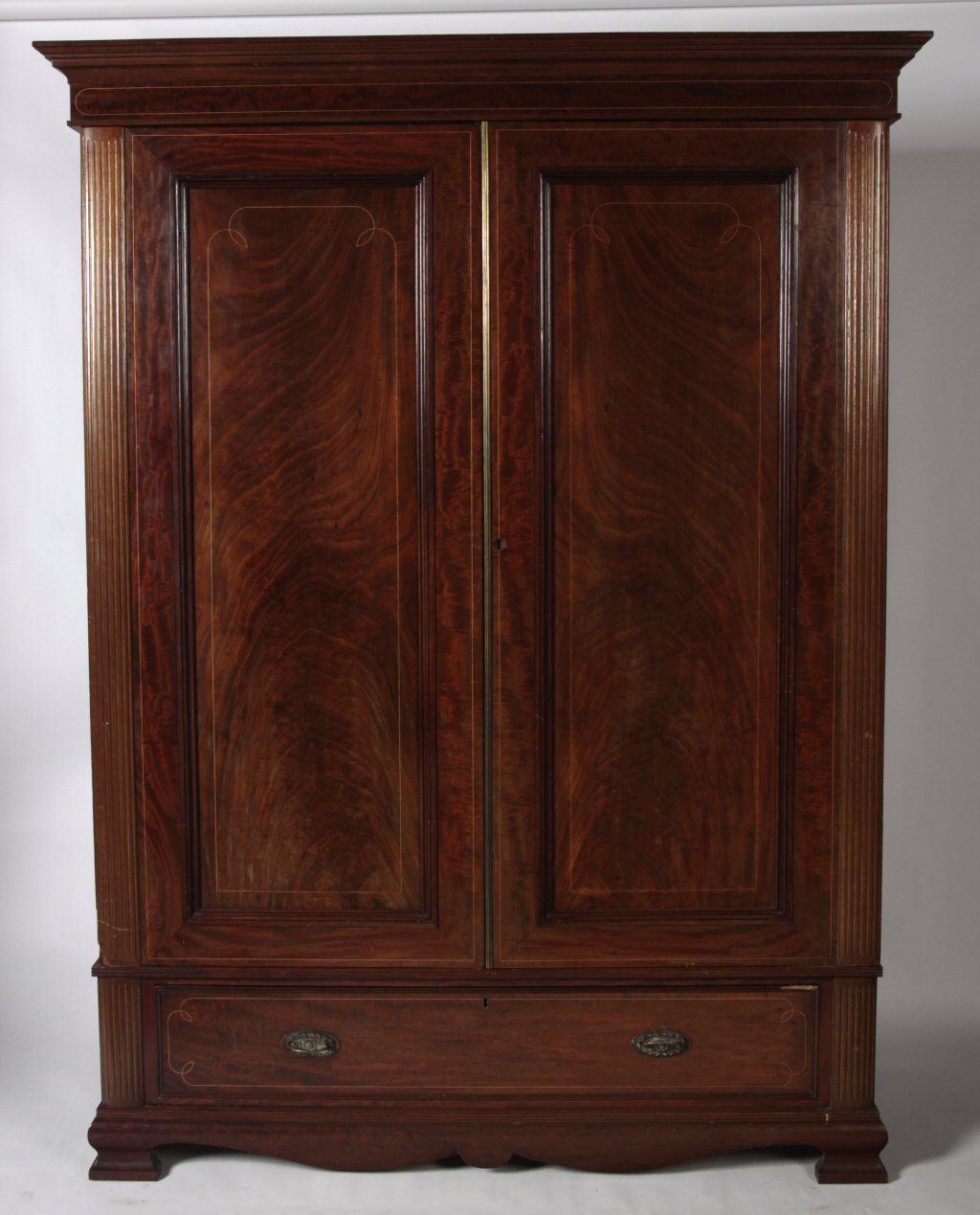 An Edwardian mahogany two door wardrobe