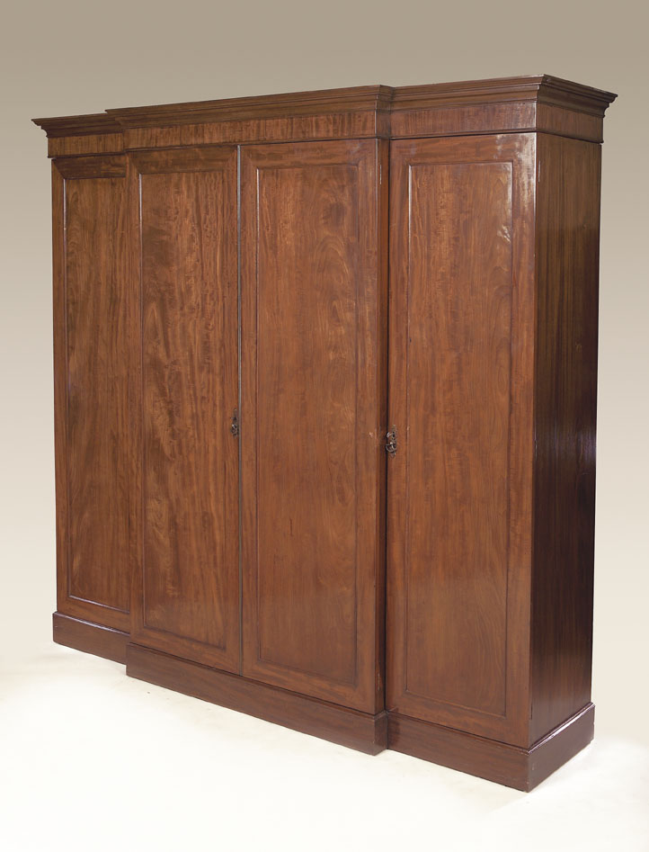 An early 19th century mahogany breakfront wardrobe,