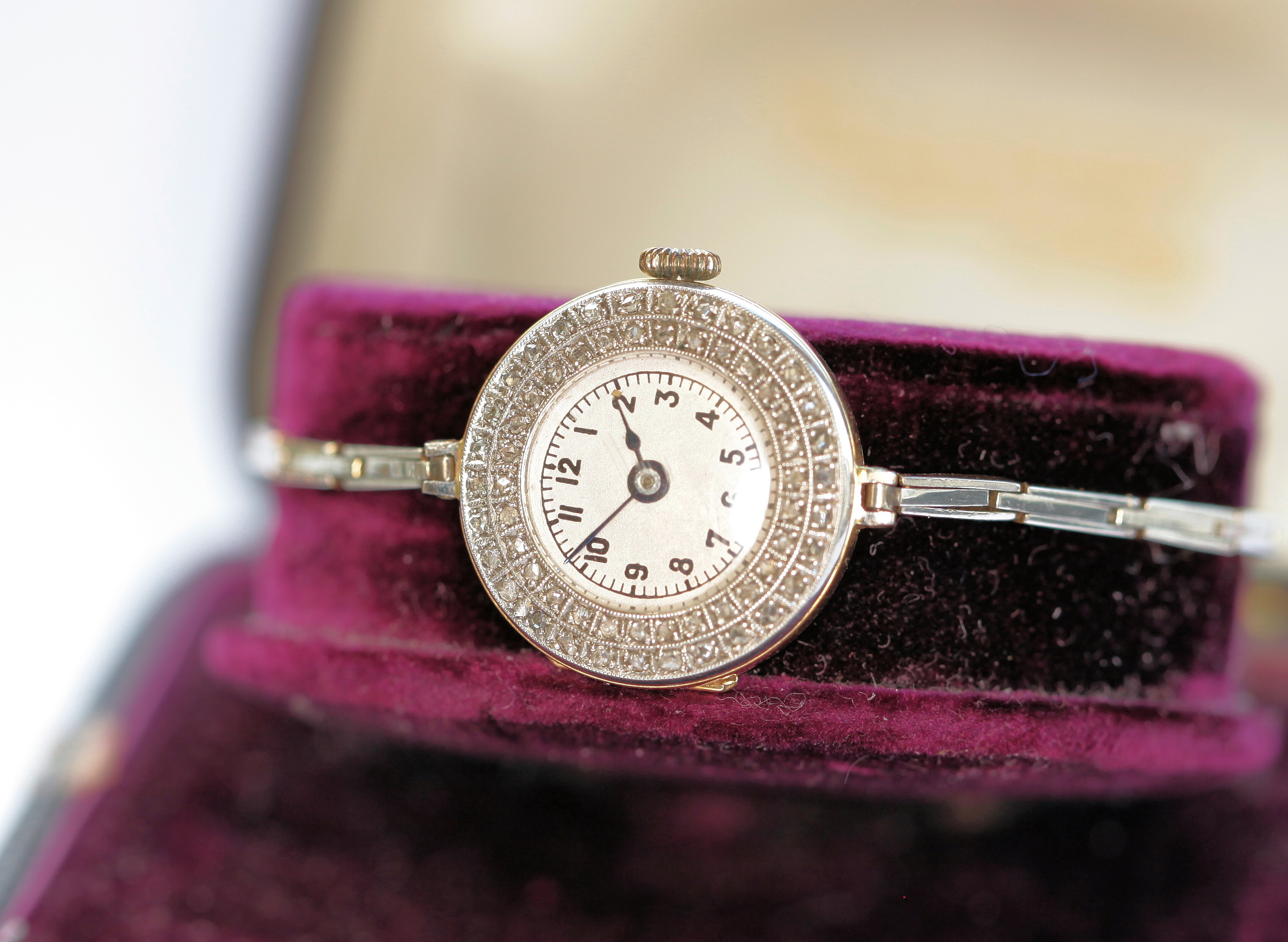 An early 20th century 18ct gold diamond set cocktail watch