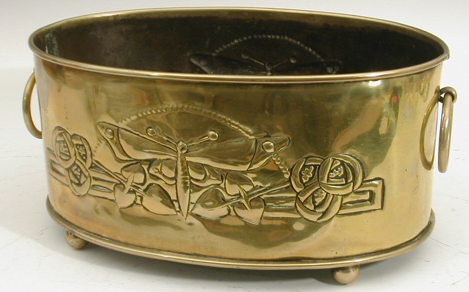 A Scottish Arts and Crafts brass jardiniere,