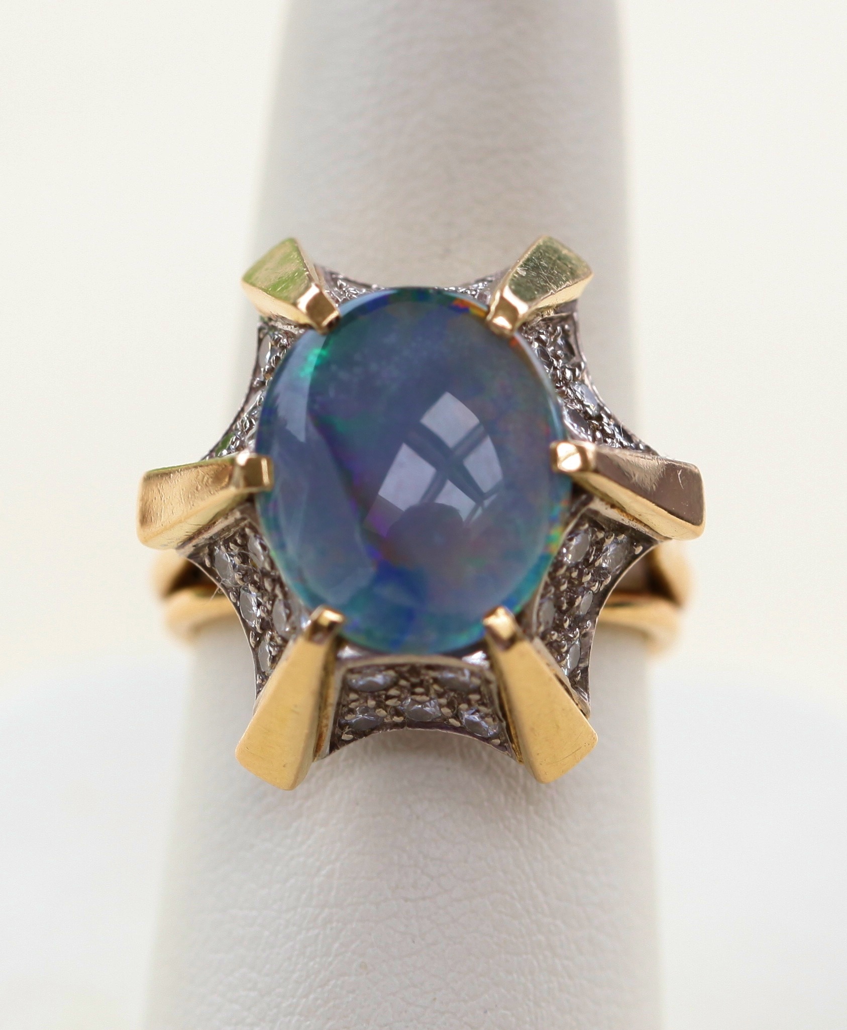 An opal and diamond set dress ring