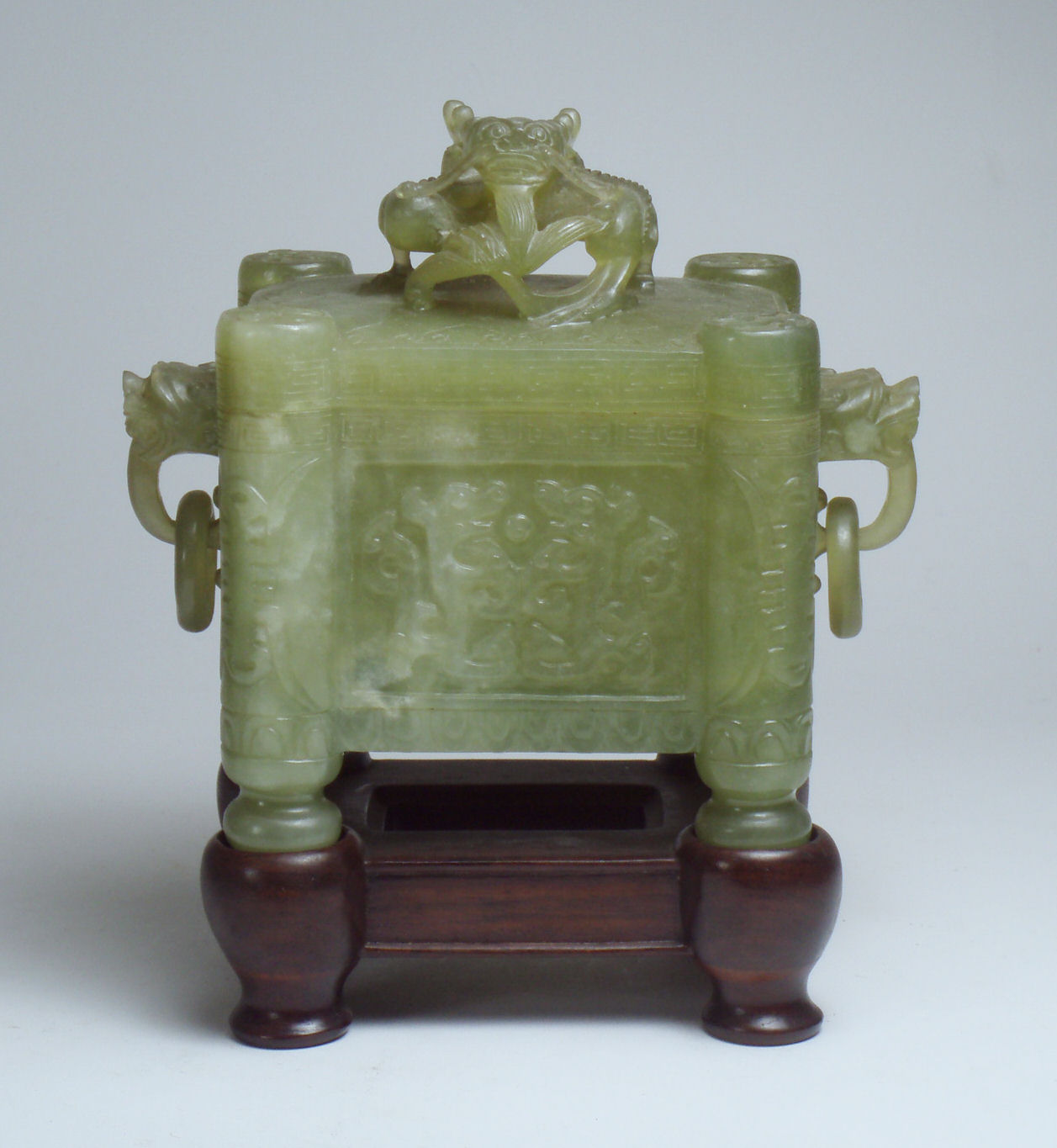 A Chinese green jade ornamental box
