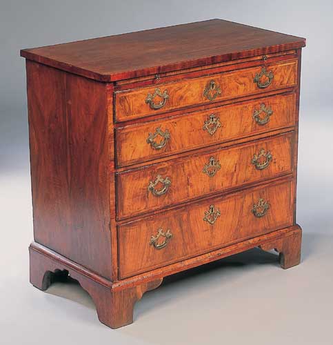 A walnut veneered bachelors chest of drawers