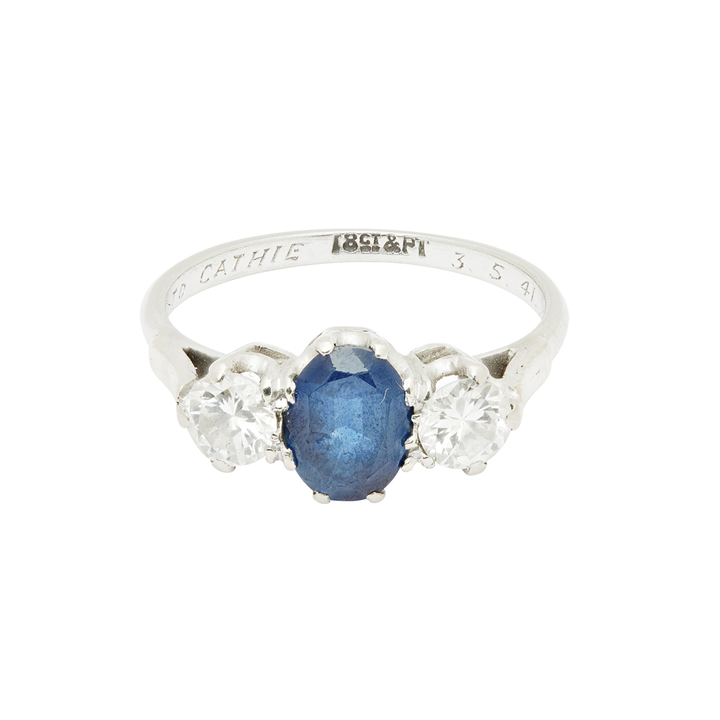 A sapphire and diamond three stone ring