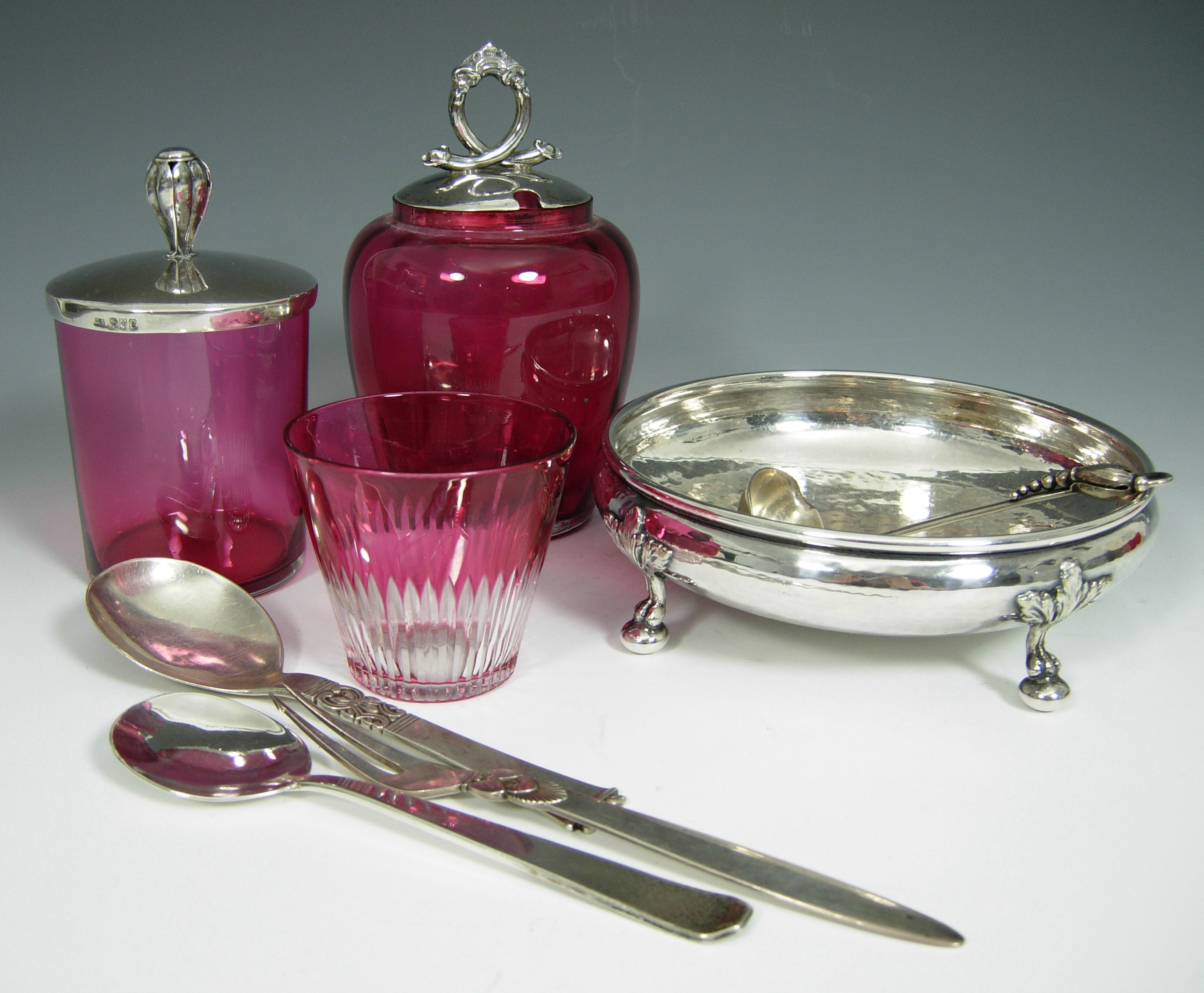 A SILVER MOUNTED CRANBERRY GLASS PRESERVE POT