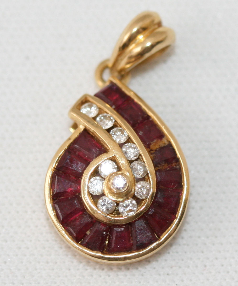 A ruby and diamond set pendant