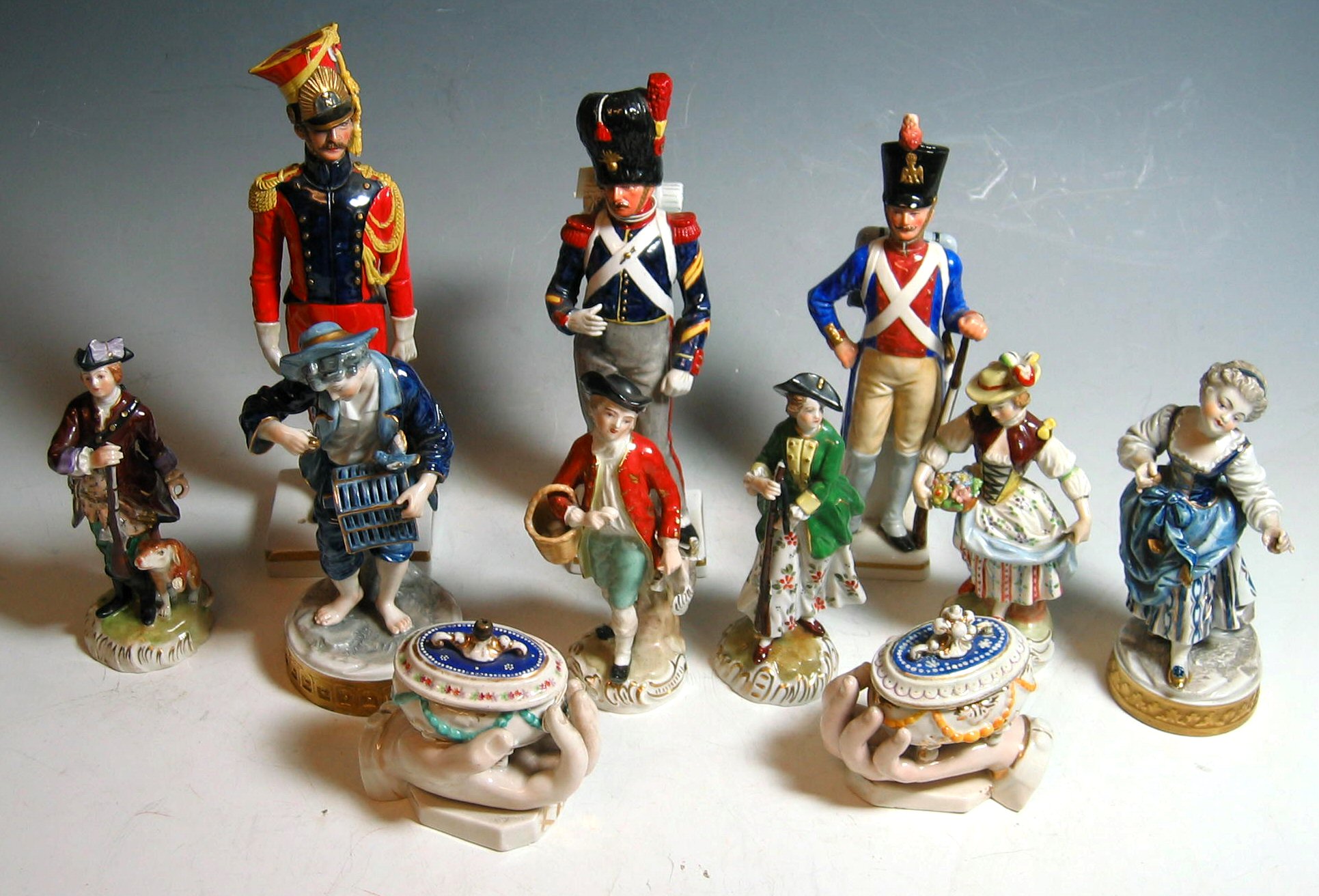 A collection of nine Continental figures,