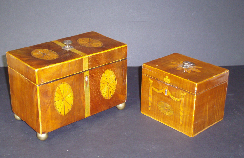 A Georgian style inlaid mahogany tea caddy