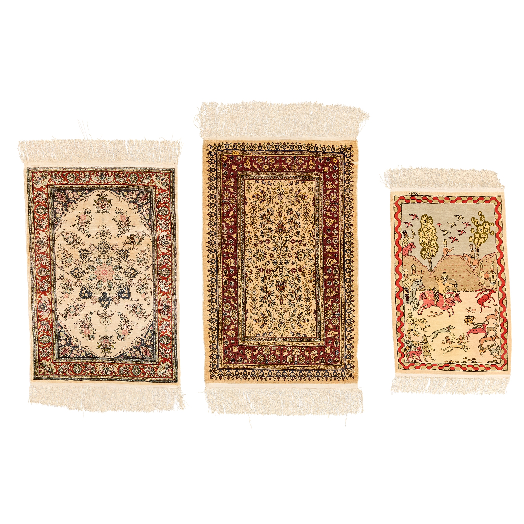 THREE SMALL FINE HEREKE SILK RUGS