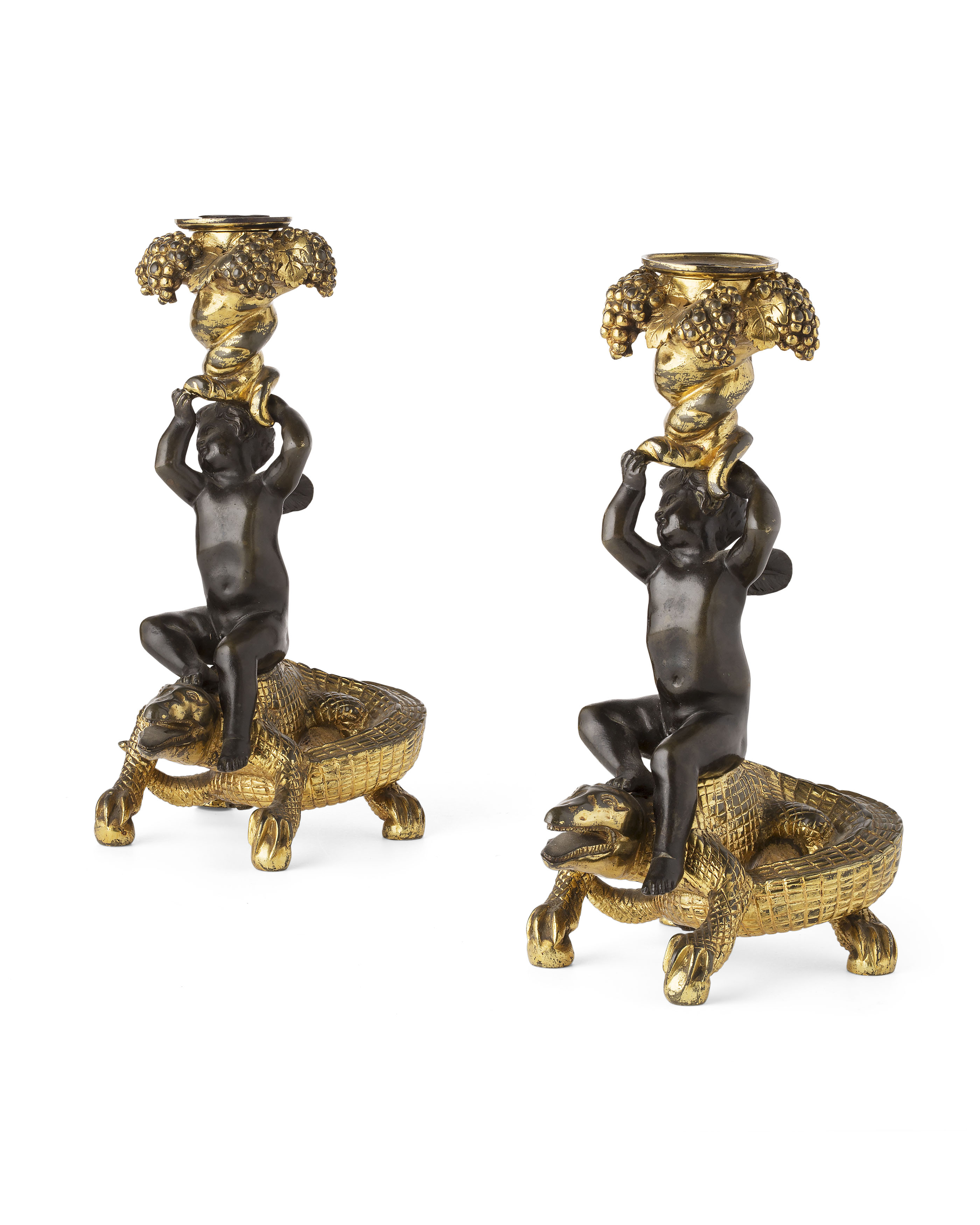 PAIR OF GILT AND PATINATED BRONZE FIGURAL CANDLESTICKS