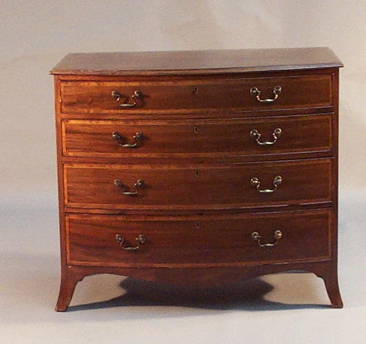 A 19th century mahogany and boxwood strung bowfront chest