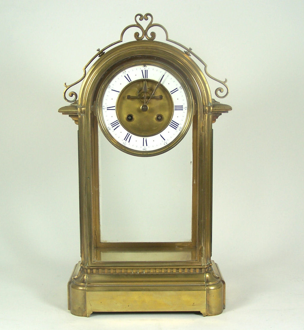A 19th century gilt brass four glass mantel clock