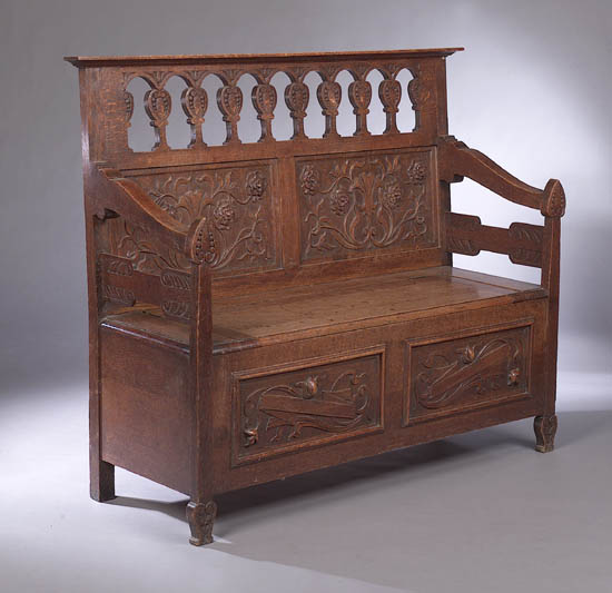 An Arts & Crafts oak hall settle