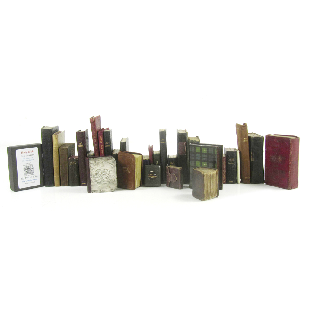 A collection of 35 miniature books, including