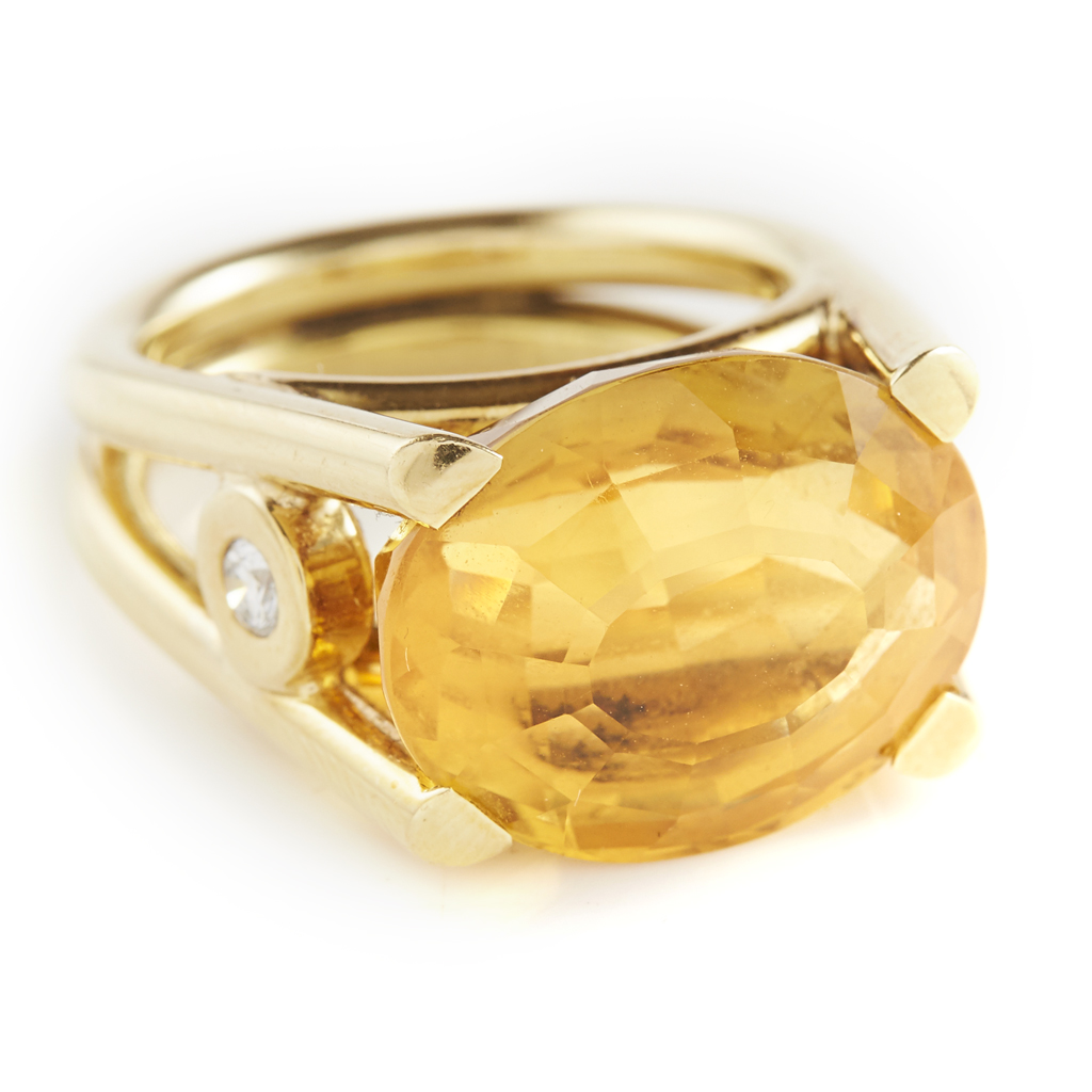 A citrine and diamond set cocktail ring