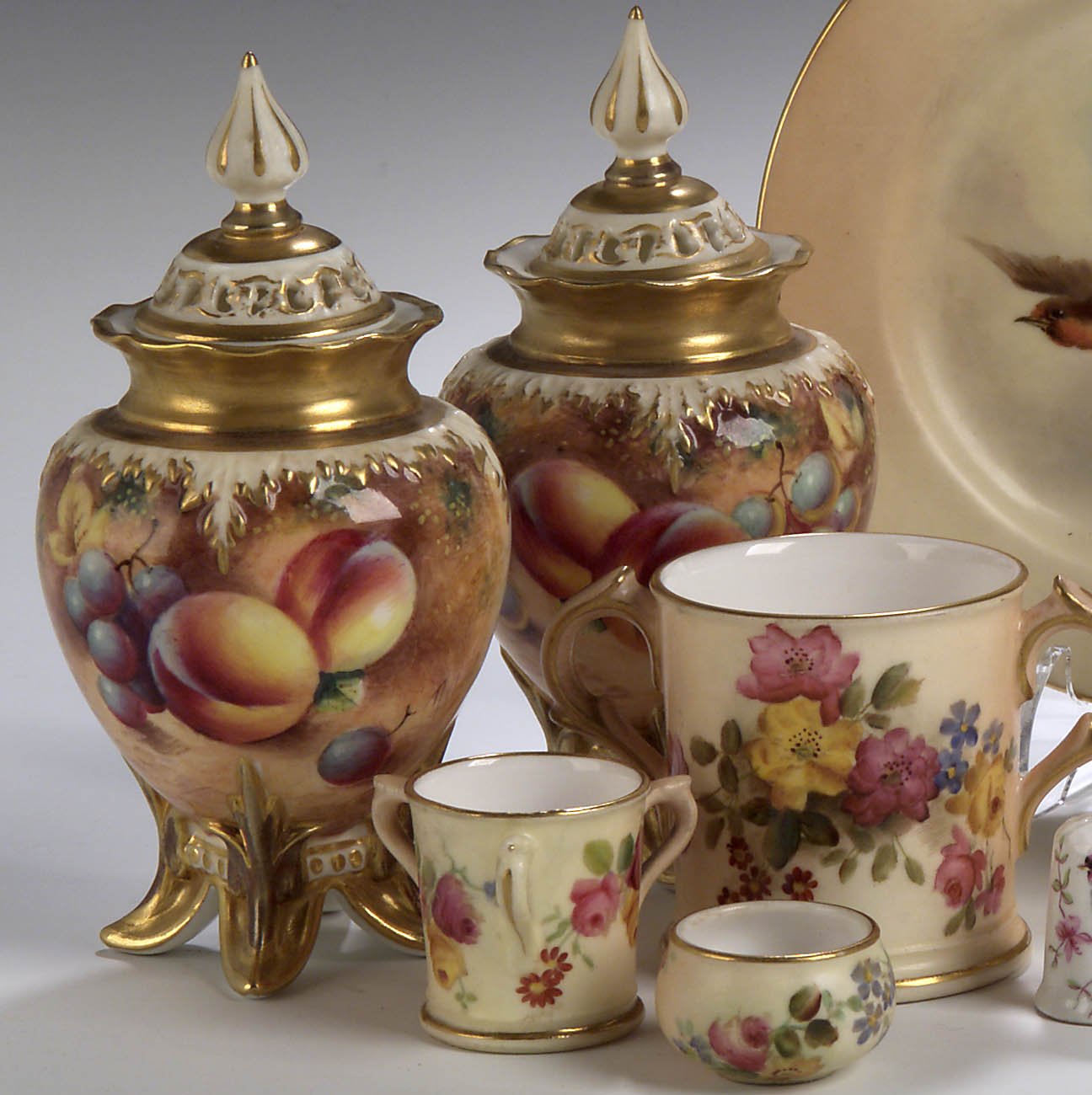 A miniature twin handled Royal Worcester cup