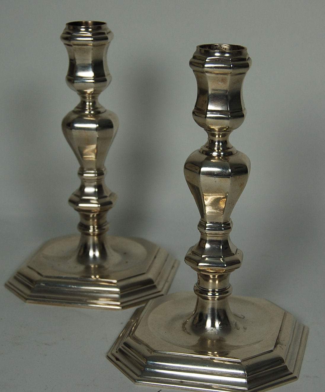 A pair of George II style candlesticks