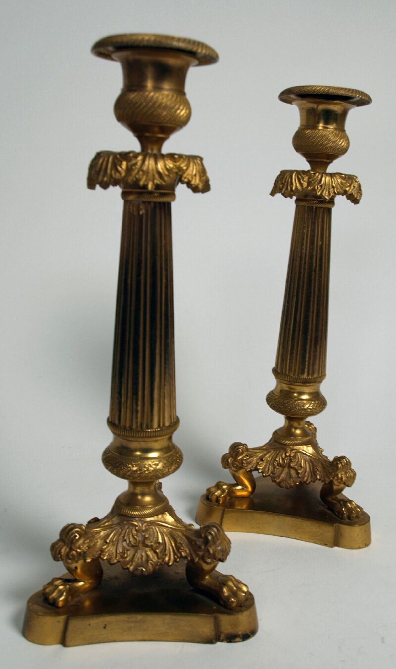 A pair of 19th century French gilt metal candlesticks In the Empire manner