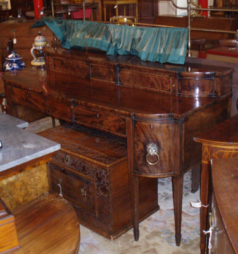 A George III period mahogany and boxwood strung sideboard