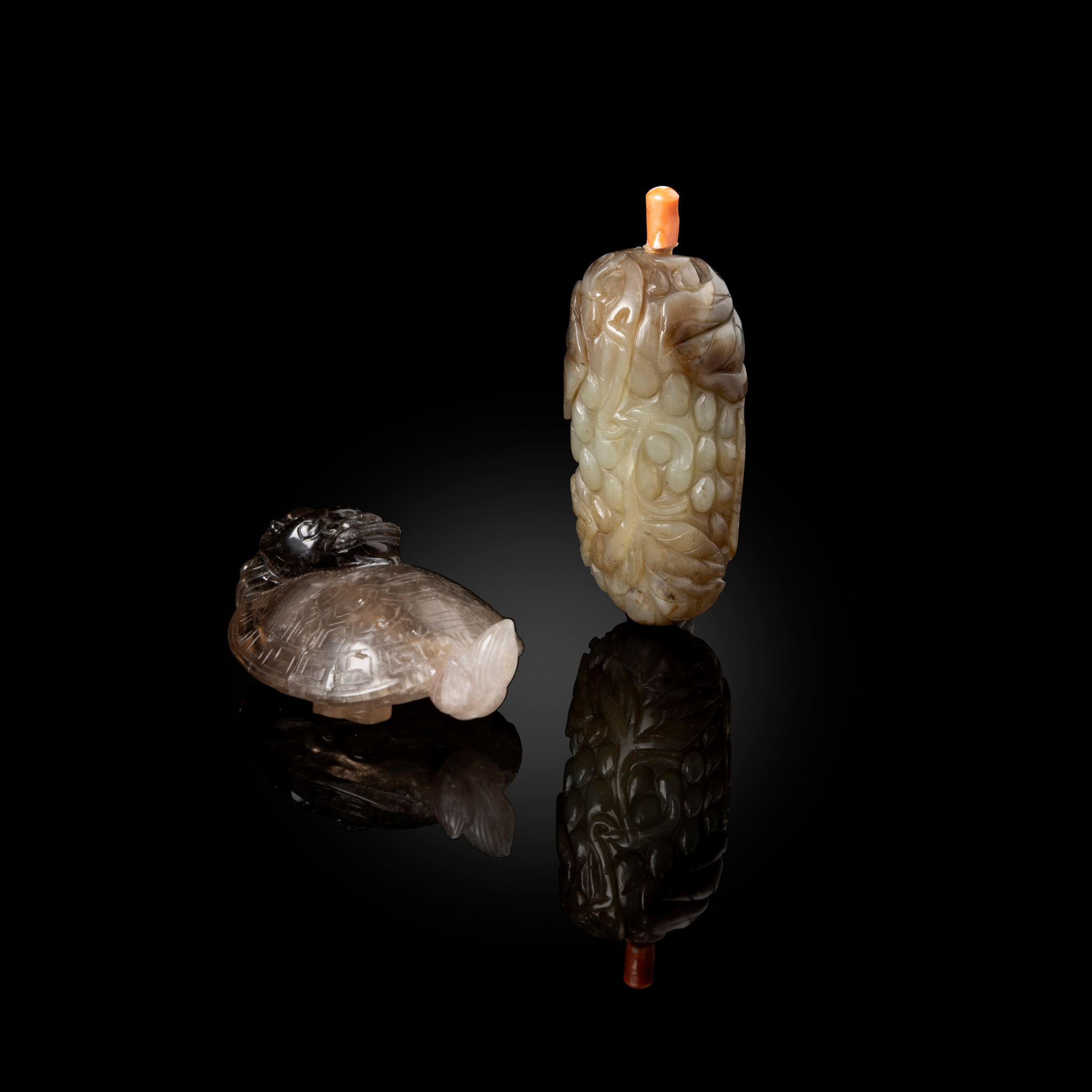 CHINESE CARVED ROCK CYRSTAL 'DRAGON-TURTLE' AND CELADON JADE 'GRAPE' SNUFF BOTTLES