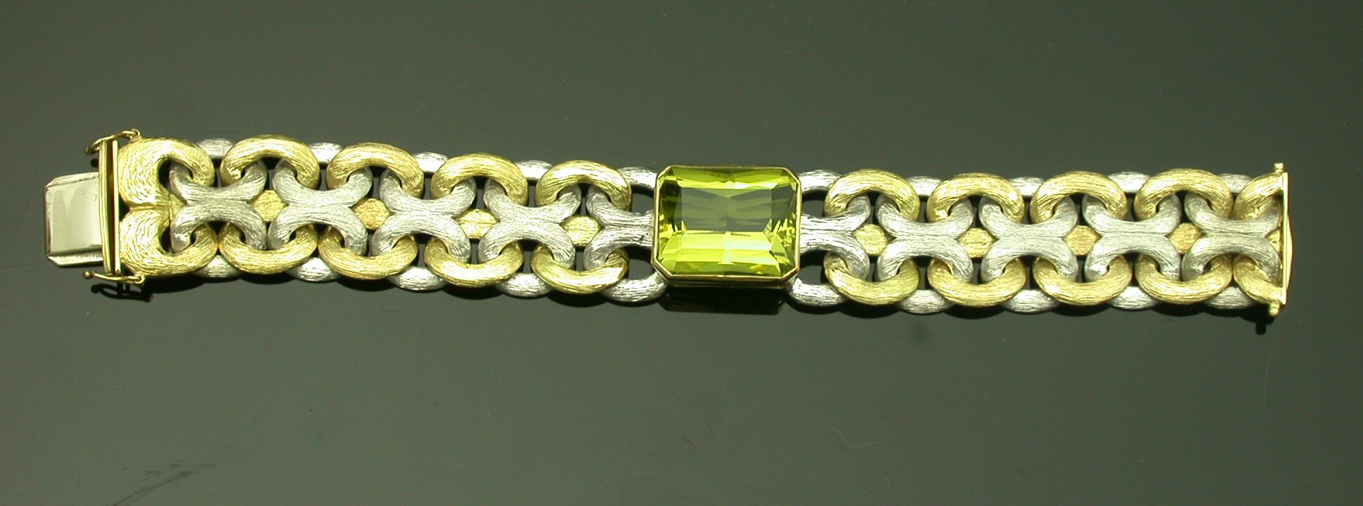An 18ct two colour gold lemon quartz set bracelet,