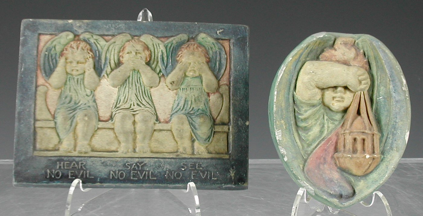 Two Compton pottery plaster plaques,