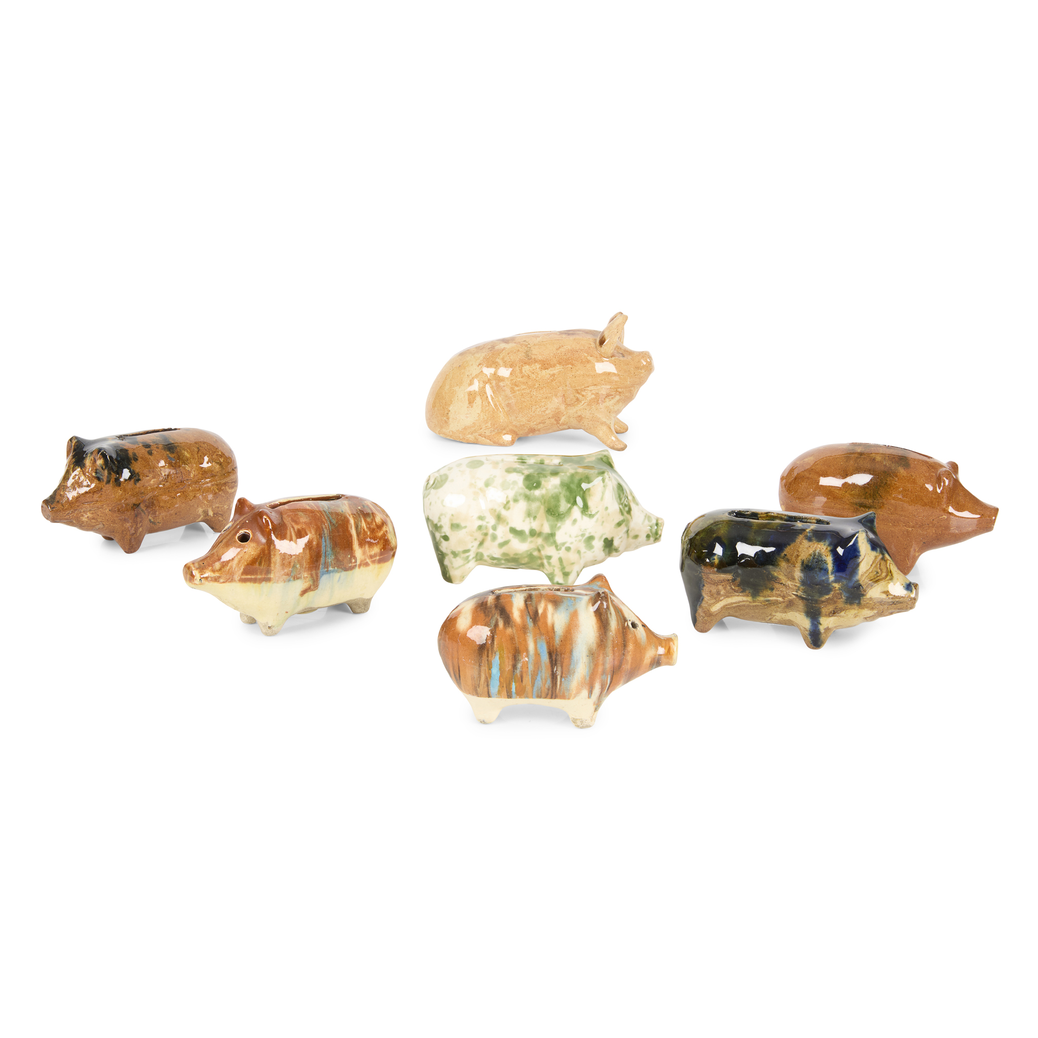 SEVEN POTTERY 'PIRLIE PIG' MONEY BOXES MODELLED IN THE FORM OF PIGS