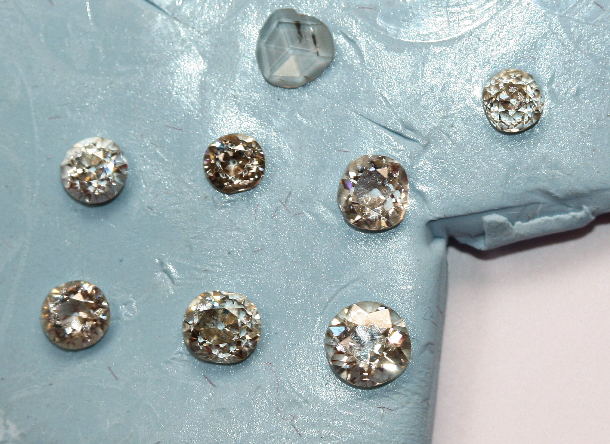 A collection of eight unmounted diamonds