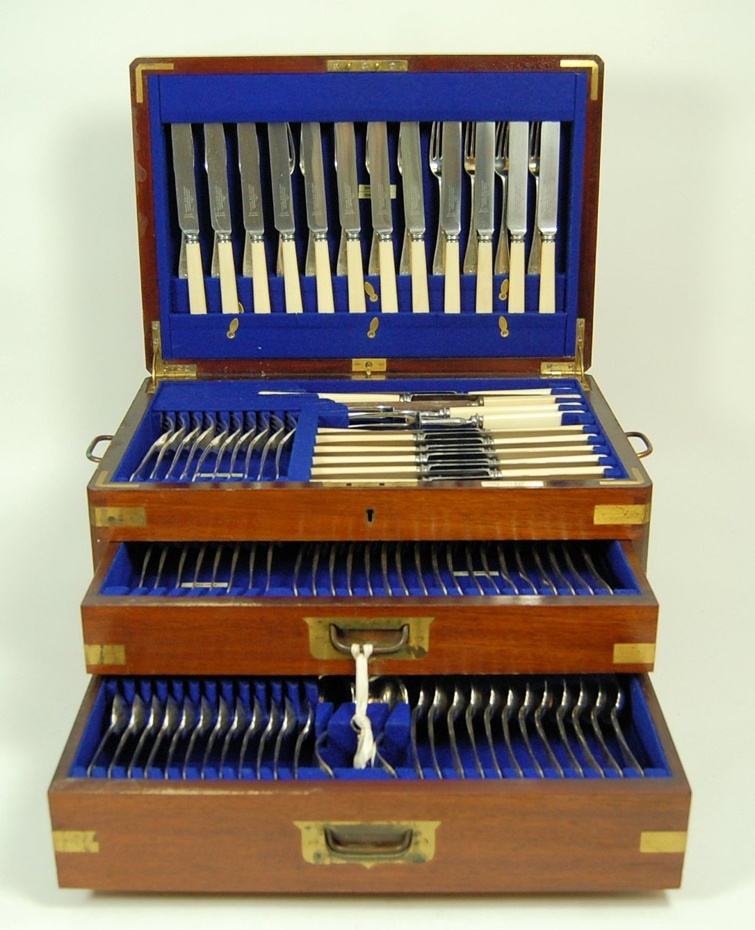 A cased canteen of Celtic point pattern flatware