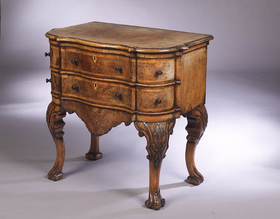 A 19th century walnut veneered commode