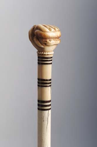 An ivory topped bone cane,