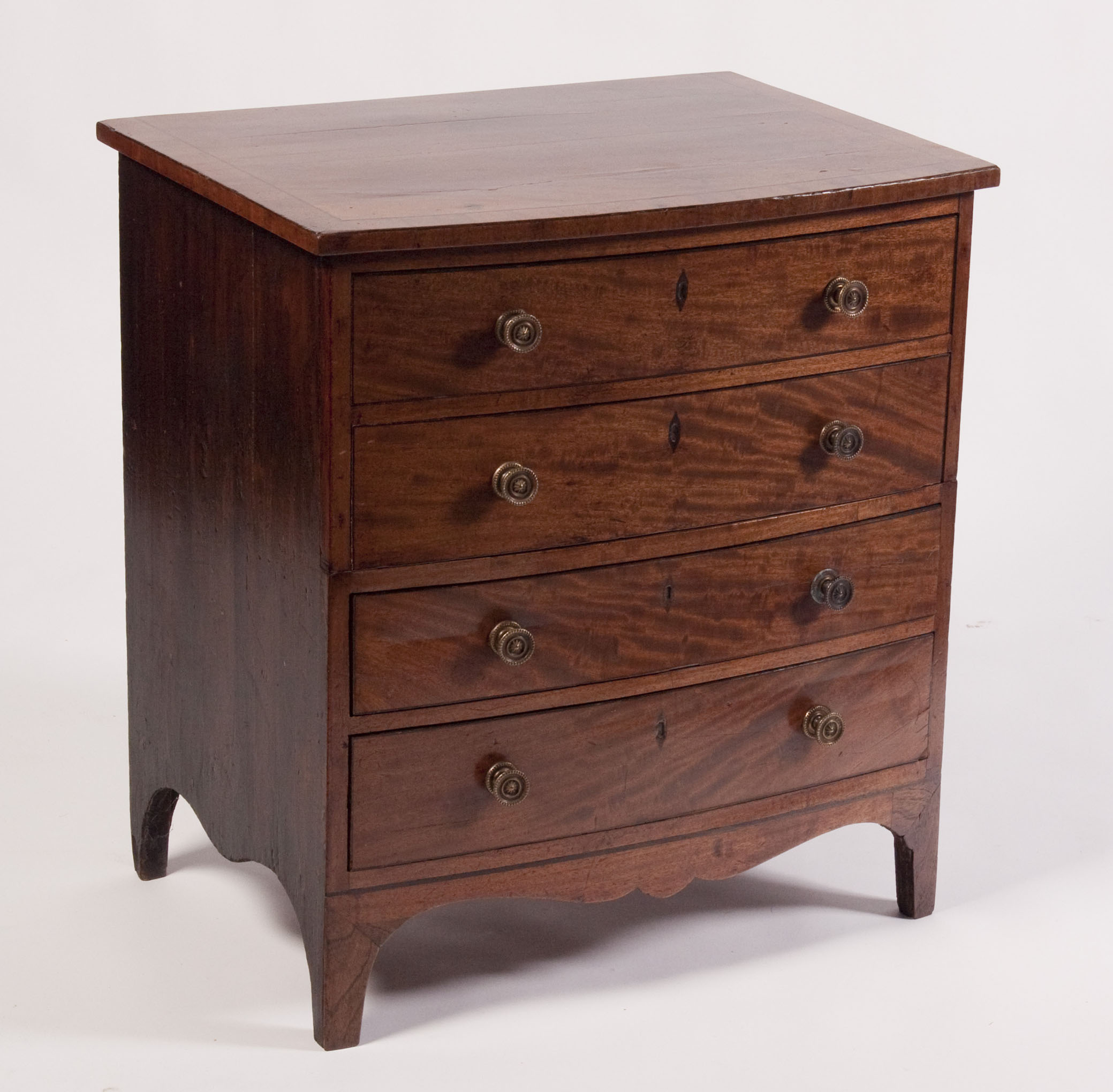 A Regency mahogany bowfront bachelor's chest