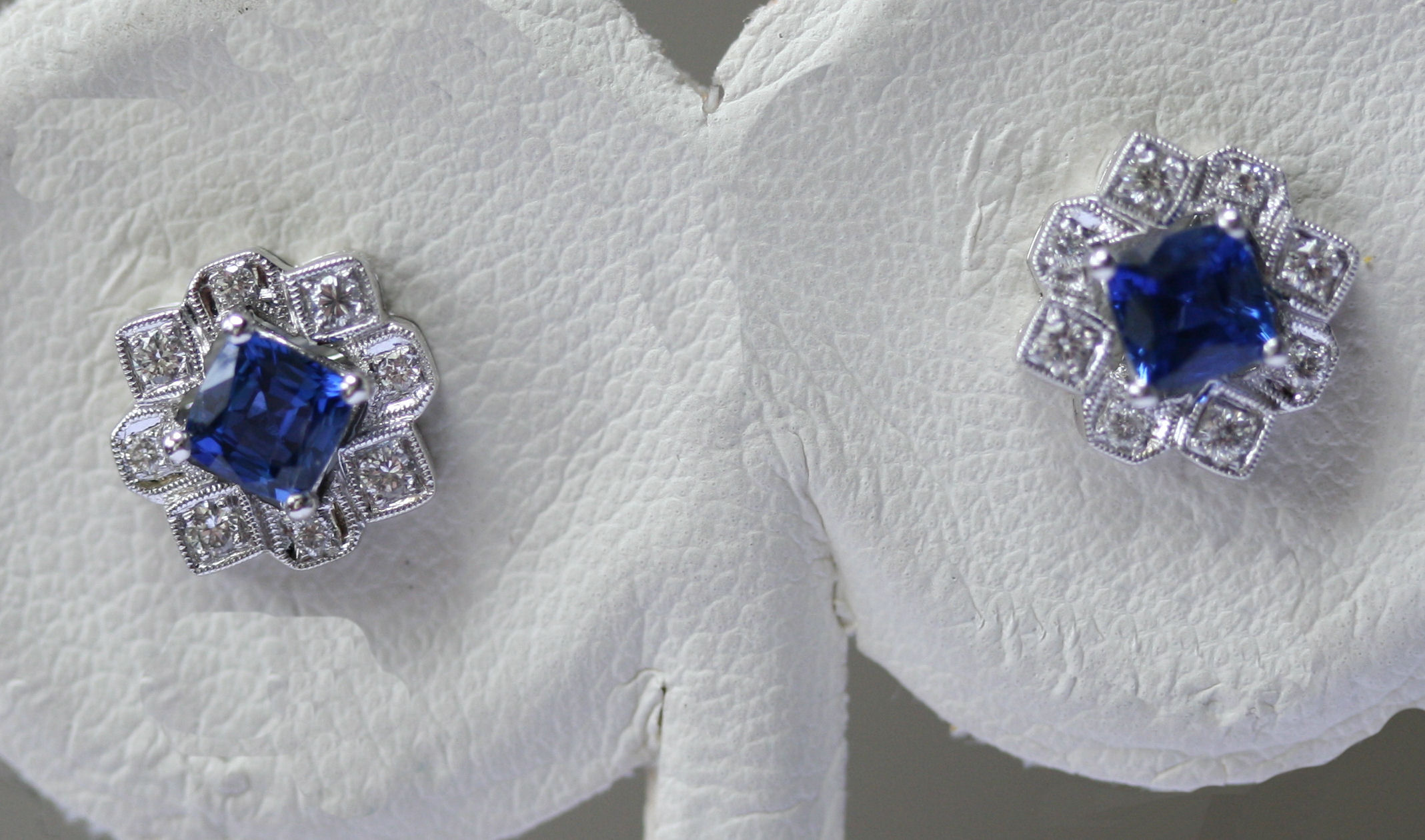 A pair of sapphire and diamond cluster earrings