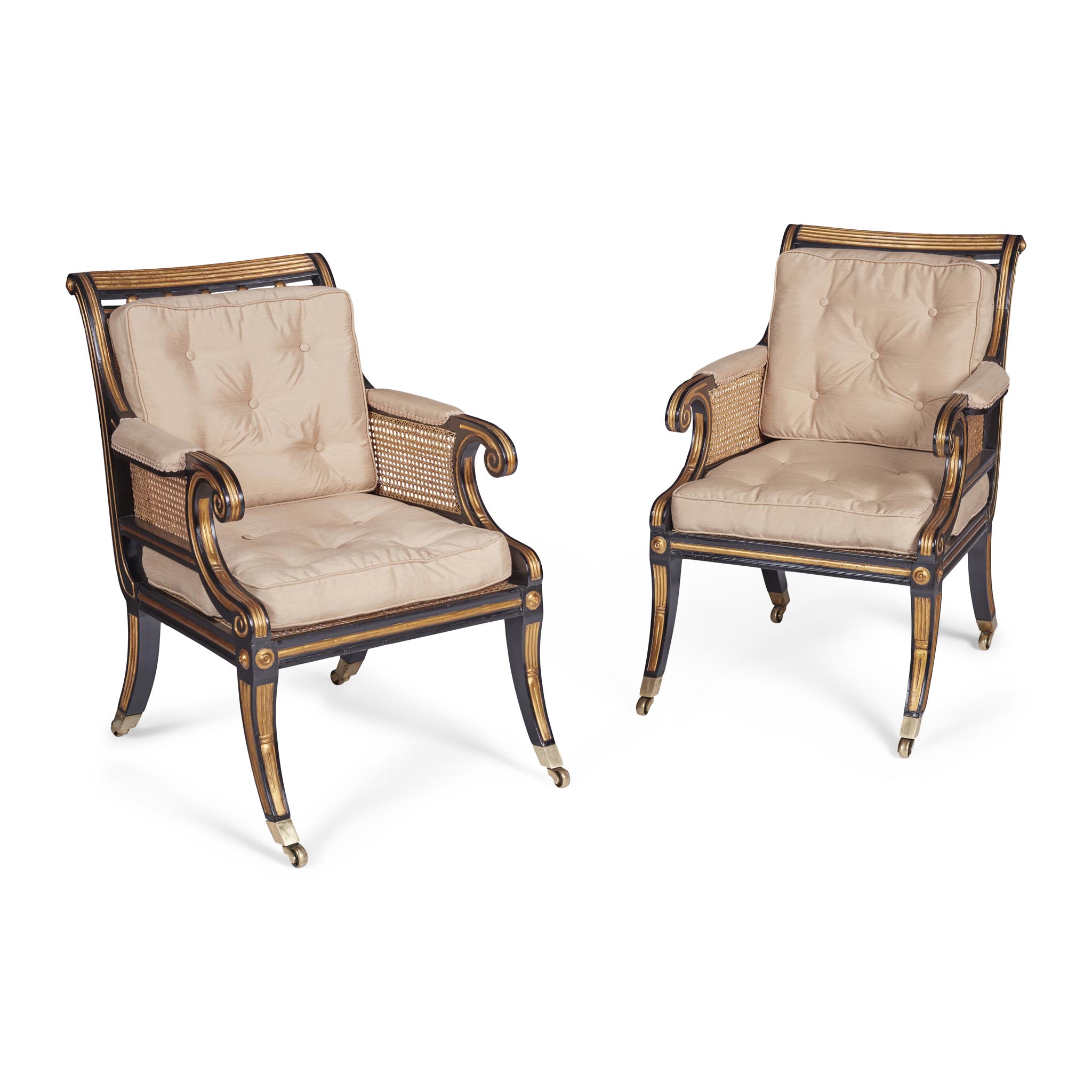 PAIR OF REGENCY EBONISED AND PARCEL GILT BERGERES