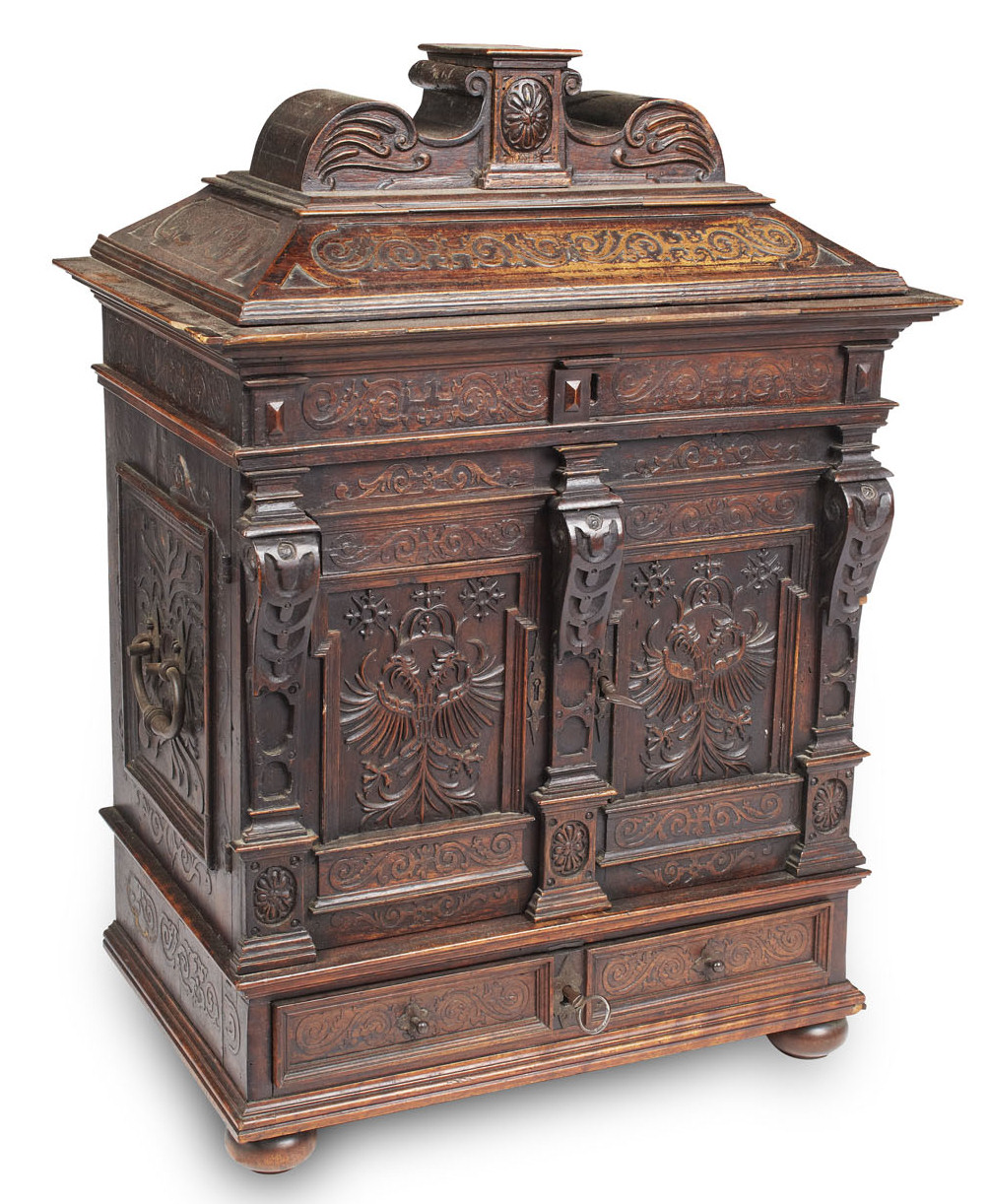 A 17th century German carved walnut table cabinet