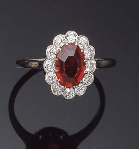 An 18ct white gold and platinum mounted red spinel and diamond cluster ring,