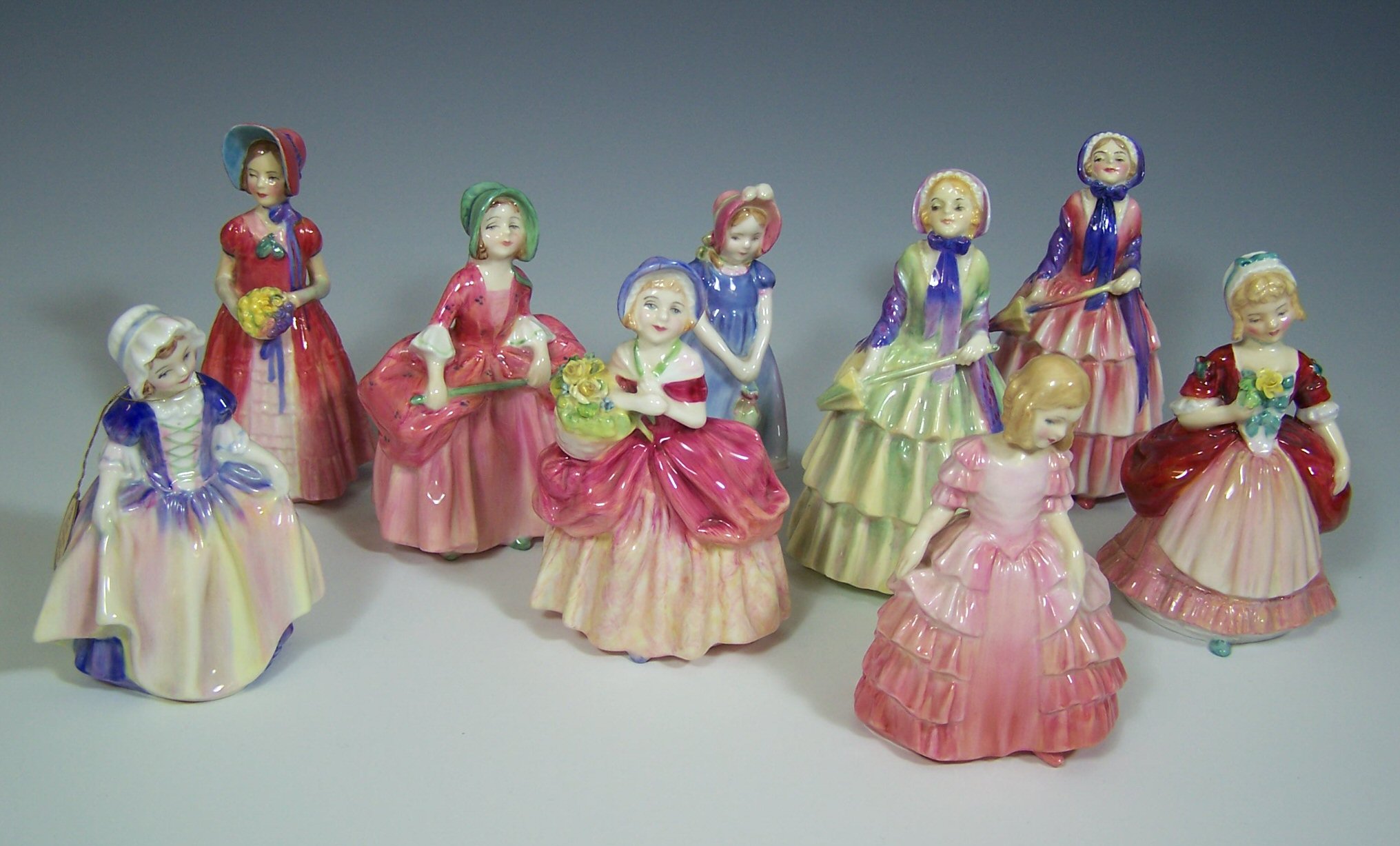 A collection of Royal Doulton figurines,