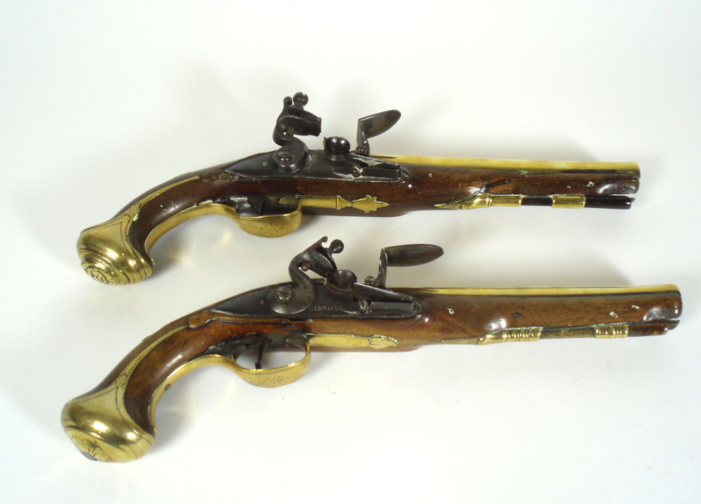 Two similar mid 18th century flintlock holster pistols